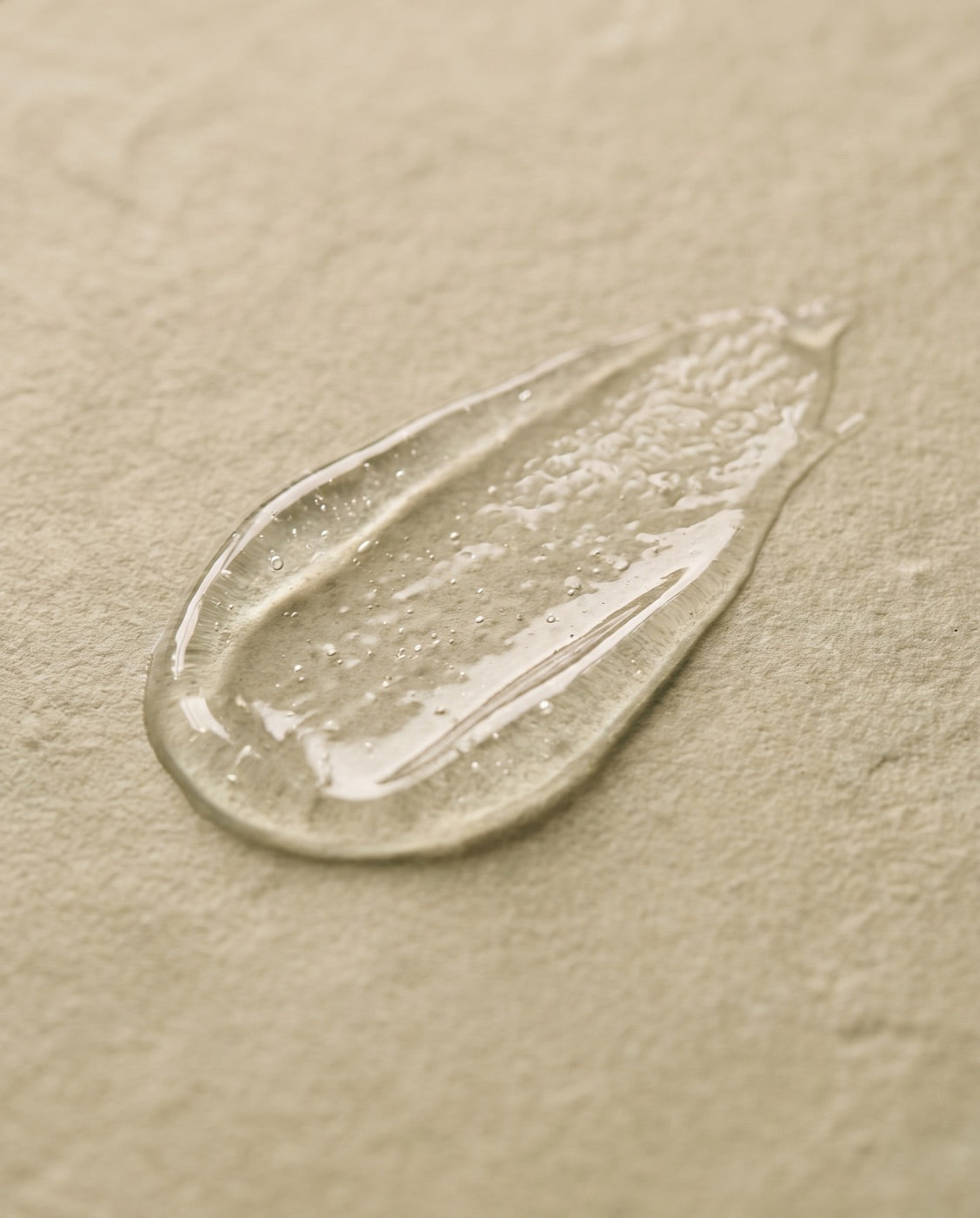 A thin breathable film of clear gel on pale sage stone
