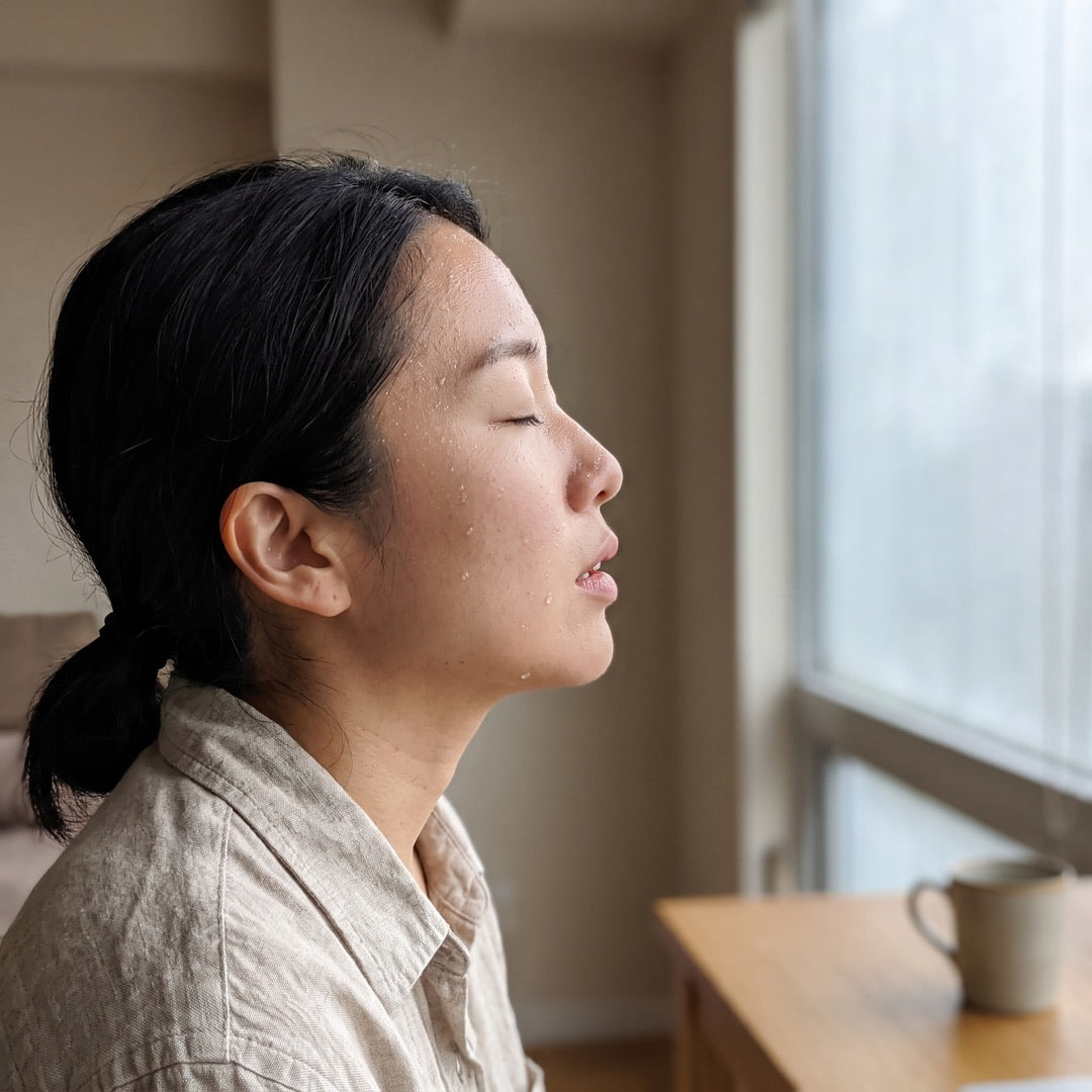 A calm exhale in soft window light